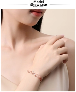 Close-up of a rose gold infinity bracelet with zircon pavé on a female wrist