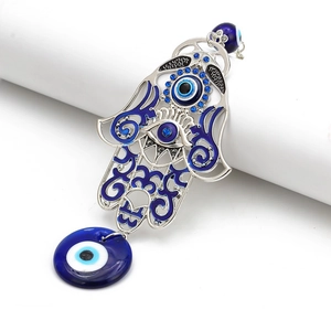 Hamsa Hand keychain with blue enamel, rhinestones and large evil eye charm on white base