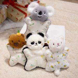 Cute animal plush finger puppets including koala, panda, and cat on soft carpet