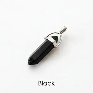 Detailed close-up of a polished black hexagonal crystal pillar pendant with silver clasp