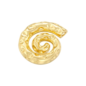 Macro detail of golden spiral pendant with hammered metal texture and shell style