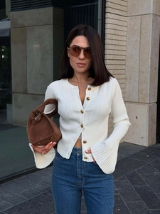Slim fit white ribbed knit cardigan with gold buttons and elegant flare sleeves