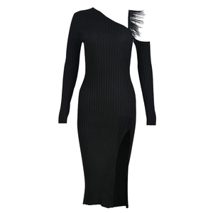 Detail of black one-shoulder knit dress featuring feather trim and ribbed texture