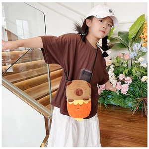 Close-up of a cute plush Capybara crossbody bag with soft brown fur on a small model