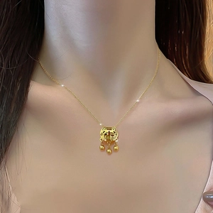 Minimalist gold-plated titanium steel necklace with a Fu character lock pendant on model
