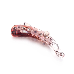 Elegant banana hair clip with red-brown acrylic flower and sparkling crystals on white background