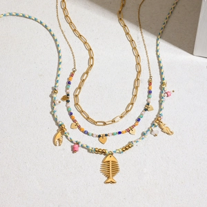 Layered gold titanium steel necklace with colorful beads and sea element pendants