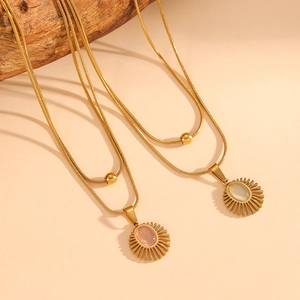 Double-layered gold snake chain necklace with cat's eye stone sun pendant and gold bead