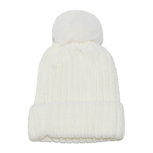 Detailed view of white knitted beanie with plush pom-pom and thick ribbed texture