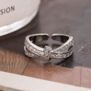 Silver cross open ring with sparkling zircon inlays in a luxurious minimalist style