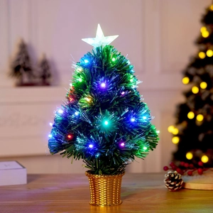 Miniature fiber optic Christmas tree with colorful glowing lights and golden basket base