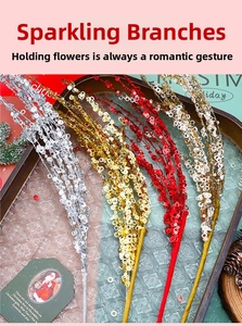 Detail of glitter firework picks in gold, silver, and red for Christmas DIY decoration