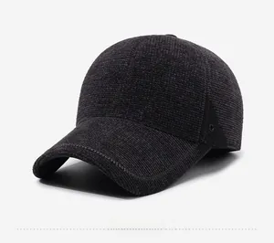 Side view of winter gray corduroy baseball cap with metal eyelets and textured fabric
