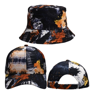 Detail of baseball cap and bucket hat combo with orange and black abstract ink pattern