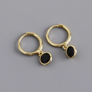 Close-up of S925 sterling silver gold plated hoop earrings with round black zircon charm