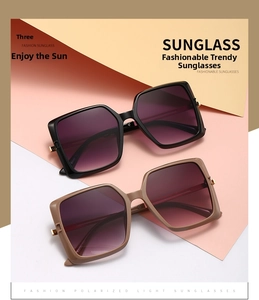 Detail of square vintage sunglasses with purple gradient lenses and metallic hinge accents