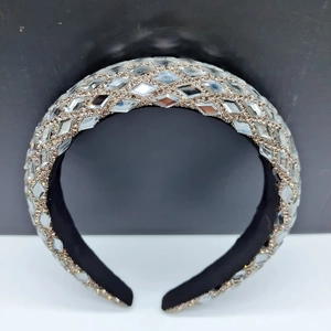 Detail of padded headband featuring silver sequins, crystal beads, and black fabric lining