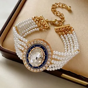 Elegant five-layer pearl bracelet with oval crystal and blue enamel detailing