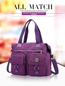 Close-up of waterproof purple nylon bag with multiple functional storage pockets