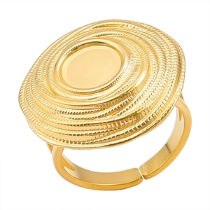 Detailed macro shot of a golden adjustable stainless steel ring with a spiral disc top