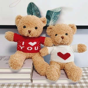Cute brown teddy bears in red and white heart sweaters for Valentine gift