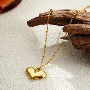Minimalist 18K gold plated stainless steel heart pendant necklace with beaded chain detail
