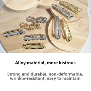 Detailed macro view of silver and gold alloy hair clips featuring hollow twisted designs