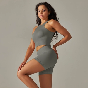 Detailed knit texture of the seamless grey-green sports crop top and biker shorts set