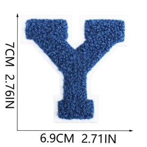 Detail of chenille towel embroidered letter Y patch in royal blue on white felt background