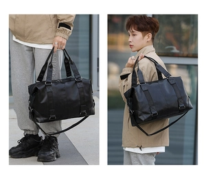 Detailed view of black PU leather travel bag shown in both handheld and crossbody styles