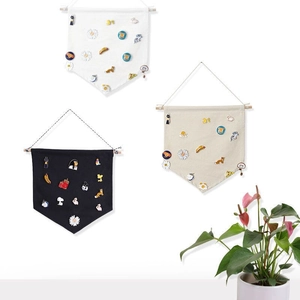 Detail of hanging canvas banners for pin collection and badge storage on white background