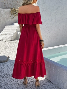 Detail view of the red off-shoulder maxi dress with tiered ruffle hem and lace panels