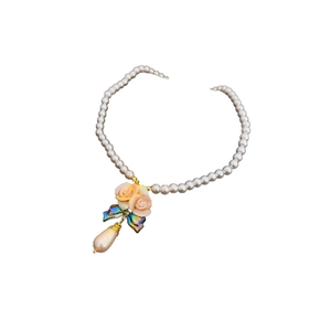 French ceramic flower necklace with pearl drop pendant and pink roses on a gold chain