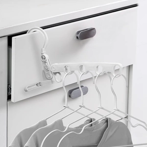 Portable folding 5-hole clothes hanger in white plastic for travel and home use