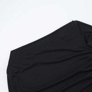 Macro detail of sexy off-shoulder neckline and ruched pleats on black slim dress