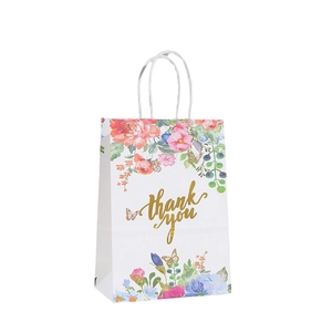 Floral paper gift bag with gold thank you lettering and white twisted rope handles
