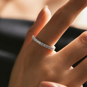 S925 sterling silver eternity ring with D color moissanite stones in a minimalist design
