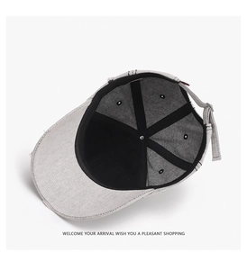 Detail view of cotton baseball cap interior showing six-panel crown and adjustable strap
