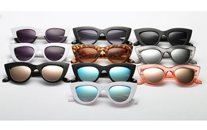Flat lay of retro cat eye sunglasses in various frame colors and lens finishes