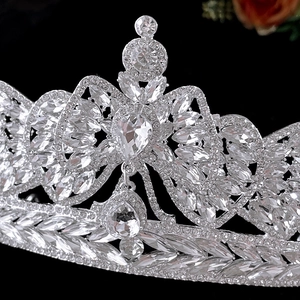 Macro shot of silver bridal crown featuring marquise crystals and water drop pendant