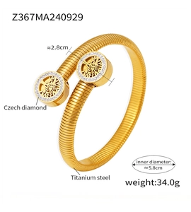 Detail of 18k gold plated stainless steel tree of life bangle with crystal inlay