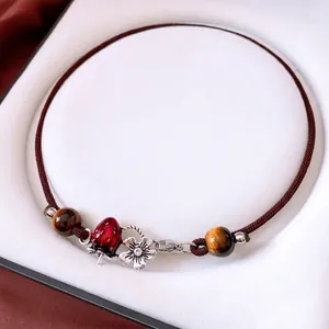 Handmade tiger eye beaded necklace with enamel strawberry and silver flower pendants