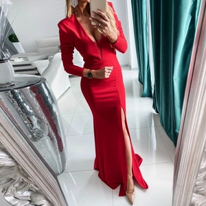 Detail of red deep V-neck long sleeve evening dress featuring a high side slit design