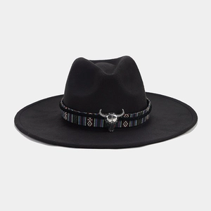 Detail of western fedora hat featuring colorful ethnic band and silver bull skull buckle