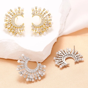 Elegant moon and starburst pearl stud earrings with sparkling cubic zirconia in gold and silver