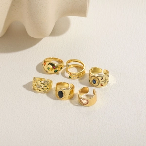 Detail of 6-piece vintage 14K gold plated rings set with zircon and black stone