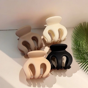 Matte claw clips in white, black, beige, and brown colors for high ponytail hairstyles