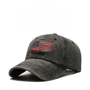 Detailed side view of washed dark gray cotton baseball cap with USA flag embroidery
