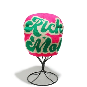 Detail of pink knitted beanie with Rick & Morty jacquard lettering and green contrast