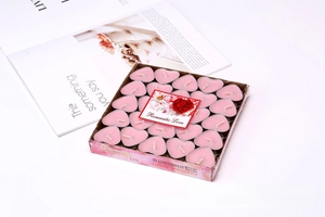 50-pack pink heart-shaped smokeless tea light candles in clear storage box